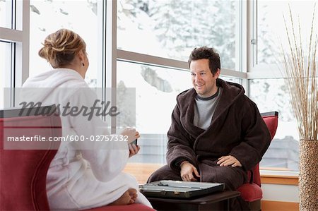 Couple in Bathrobes Playing Backgammon
