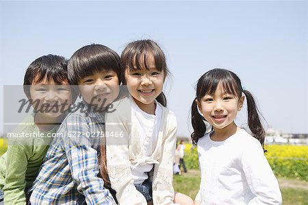 Japanese children smiling and looking at camera