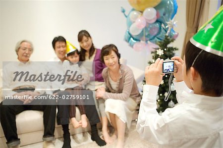Child taking snap of his family