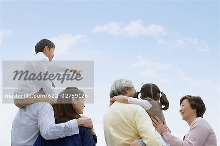 Asian family standing together