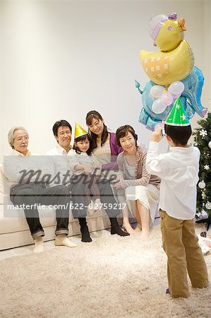 Child taking snap of his family