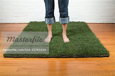 A woman standing on grass