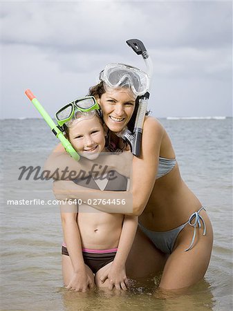 Close-up of a mother and daughter wearing snorkel gear