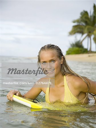 Portrait of a teenage girl smiling on a boogie board