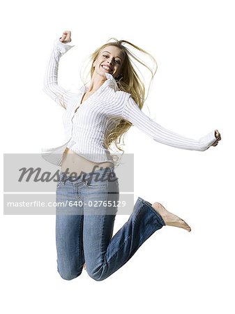 Woman leaping and smiling