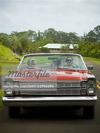 Three young women traveling in a car