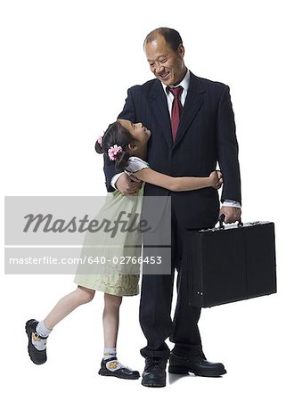 Father and his daughter looking at each other,smiling