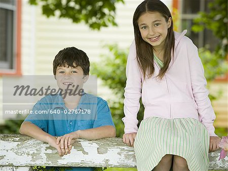 Portrait of a girl and a boy smiling