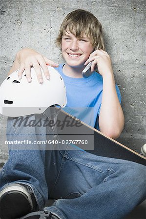 Portrait of a teenage boy using a mobile phone