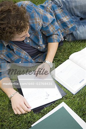 Male student studying outdoors
