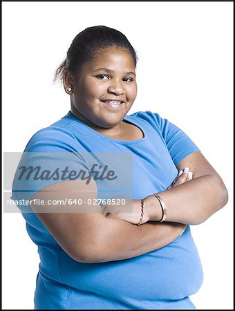 Heavyset young woman with arms folded