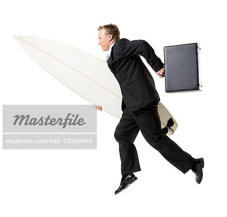Surfing businessman