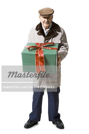 Older man holding present