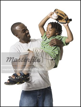 Father playing with young son