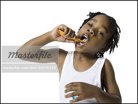 Boy brushing his teeth