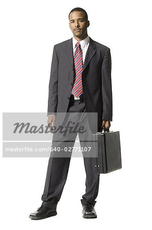 Businessman standing with briefcase