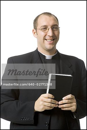 Male priest with bible