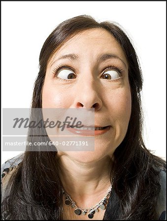 Closeup of woman with crossed eyes making funny face
