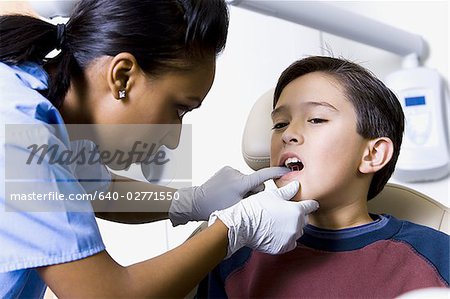 Boy having dental exam