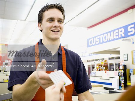 Cashier taking money from customer