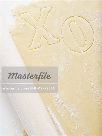Detailed view of dough with X and O