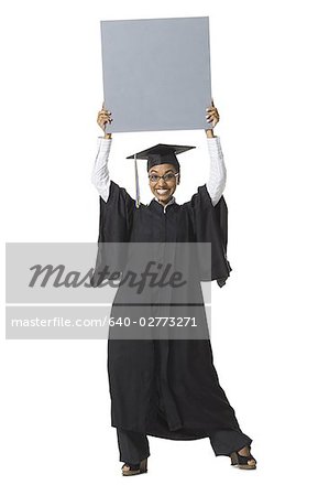 Woman in graduation gown and Blank Sign with blank sign