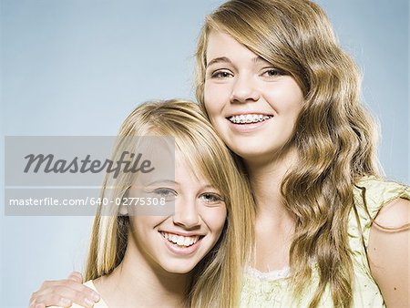 Two girls embracing and smiling