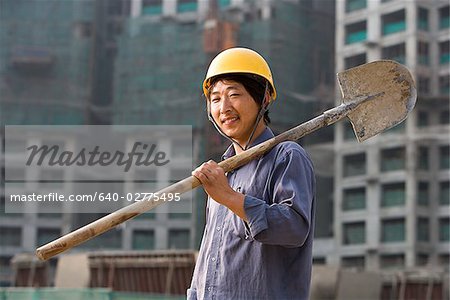 Construction worker outdoors with helmet smiling