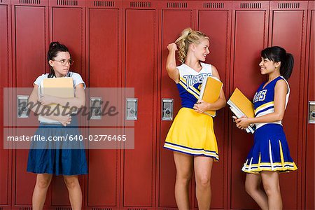 Two High School cheer leaders and a nerd.