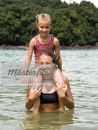 young woman and girl in the water