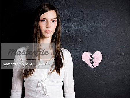 young woman against a chalkboard