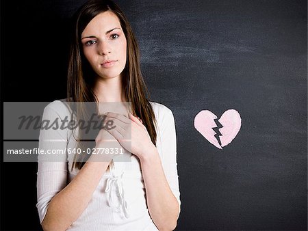 young woman against a chalkboard