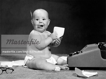 1960s BABY AT ADDING MACHINE