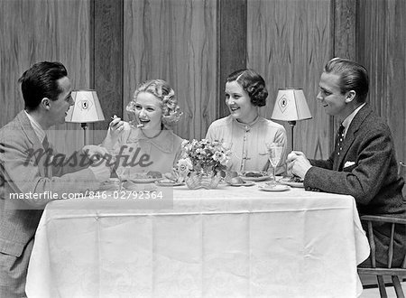 1930s 1940s 2 COUPLES DINING AT RESTAURANT TABLE