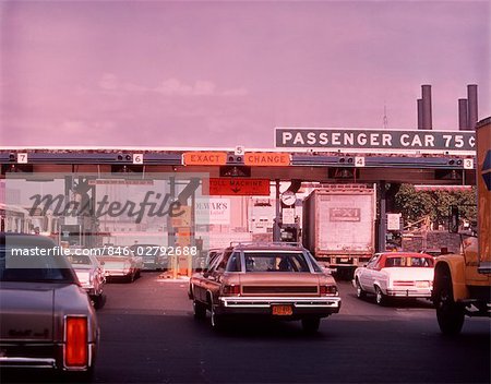 1960s CARS AT TOLL BOOTH OF QUEENS MIDTOWN TUNNEL NEW YORK CITY