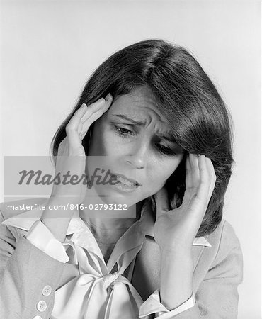 1980s PORTRAIT WOMAN HANDS MASSAGING TEMPLE FOREHEAD HEADACHE DISTRESS STRESS