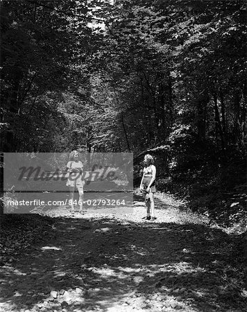 TWO YOUNG LADIES WOODS NATURE TREES PATH 1940s