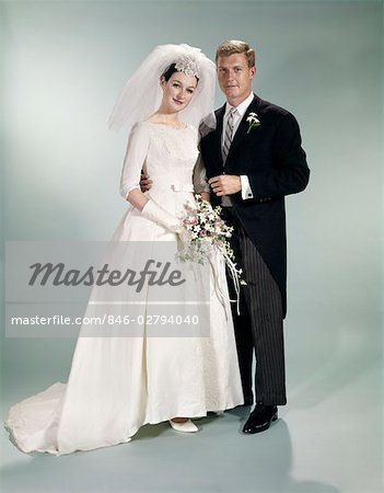 1970s FORMAL FULL LENGTH PORTRAIT OF BRIDE AND GROOM