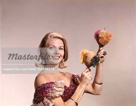 1960s BLOND WOMAN IN CARIBBEAN COSTUME SHAKING MARACAS