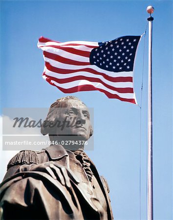 STATUE OF GEORGE WASHINGTON WITH AMERICAN FLAG ABOVE