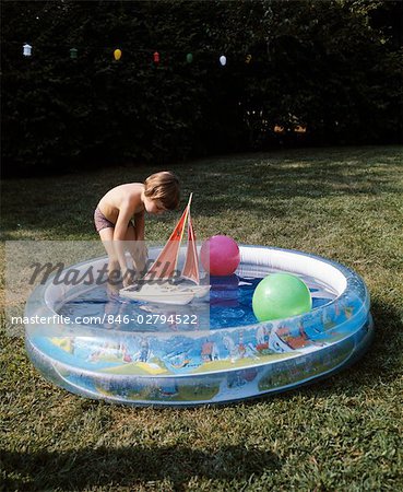 1970s BOY TODDLER PLAYING TOY BOAT BACKYARD PLASTIC INFLATABLE SWIMMING POOL