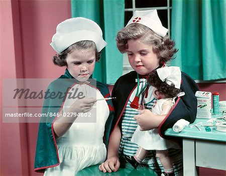 1950s TWO LITTLE GIRLS PLAYING NURSE NOSTALGIA