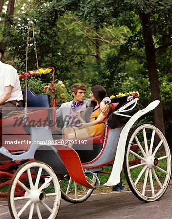 1960s MAN WOMAN HANSOM CAB CARRIAGE