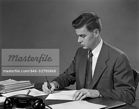 1950s MAN BUSINESS DESK PEN PAPERWORK SUIT TIE TELEPHONE