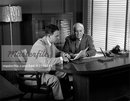 1950s MEN MEETING BUSINESS SUITS