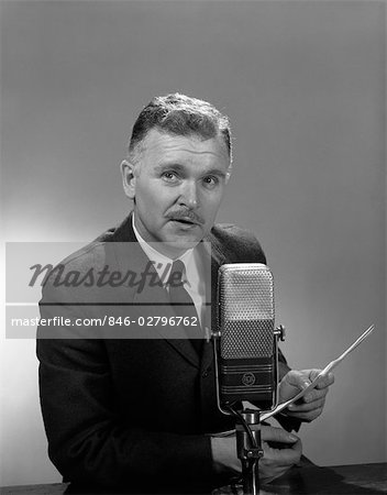 1950s 1960s OLDER MAN SPEAKING INTO MICROPHONE HOLDING PAPERS RADIO TELEVISION NEWSMAN REPORTER ANNOUNCER