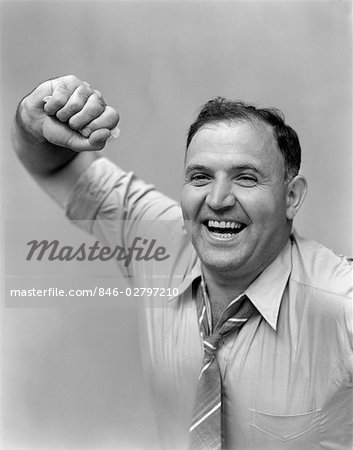 1940s PORTRAIT OF MAN IN SHIRT AND TIE HOLDING HANDKERCHIEF SMILING