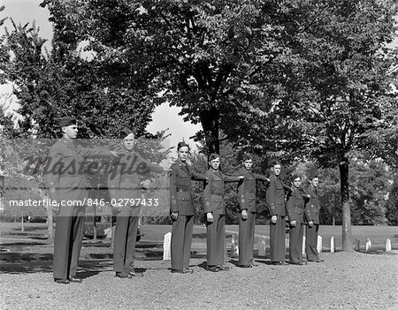 1940s 8 MEN IN UNIFORM STANDING IN ROW MILITARY UNIFORM ARMY ROTC TRAINING COMMAND COLLEGE CAMPUS