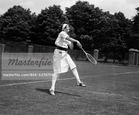 1920s WOMAN PLAYING TENNIS