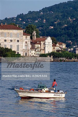 Small boat on Lake Maggiore with Isola Bella beyond, in Piemonte, Italy, Europe